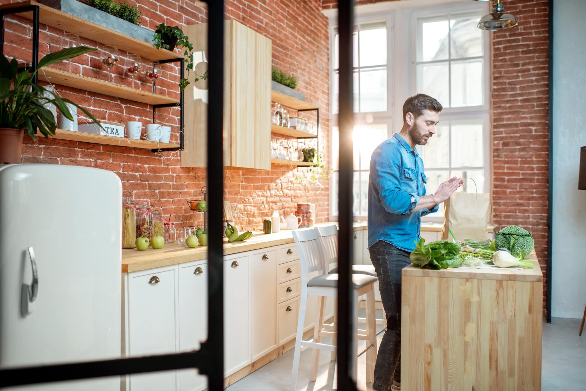 Man with healthy food on the kitchen